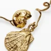 Unregelmäßige goldene Muschelohrringe Zalio Unregelmäßige goldene Muschelohrringe Zalio